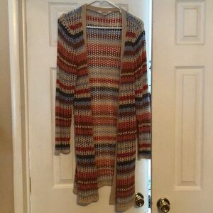 Woman’s long crocheted cardigan
